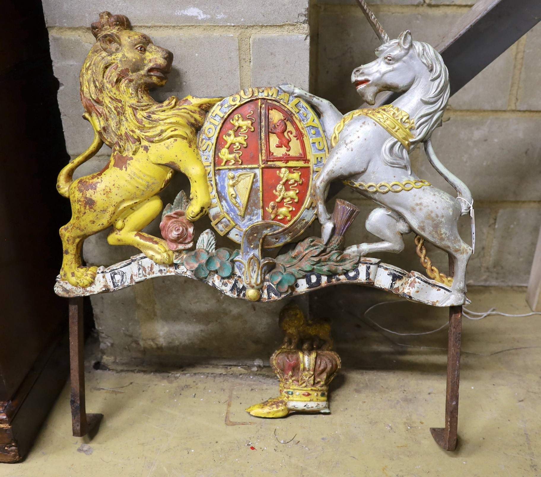 A painted cast iron Royal Coat of Arms, crown detached, width 70cm, height 78cm